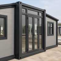 Maison conteneur extensible à double aile de 30 pieds, cadre noir, préfabriquée, pliable, modulaire