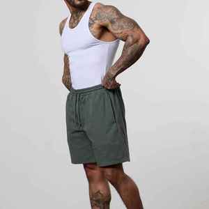 Short d'entraînement décontracté pour hommes avec logo Short de sport tricoté en spandex Short de course teint uni été avec motif de poches - Product Image 2