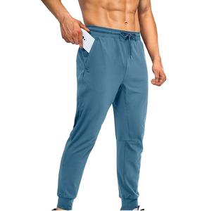 Pantalones de chándal de lona informales ajustados de alta calidad para hombre, pantalones de chándal personalizados 100% poliéster, bolsillos deportivos con cremallera - Product Image 1