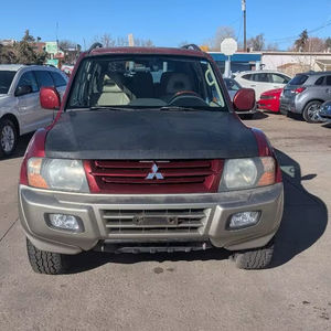 2002 Mitsubishi Montero Base 4DR 4WD Pick-up Boîte de vitesses manuelle automatique Essence Gaz Options électriques Cuir Clair Foncé Hilux Gauche - Product Image 1