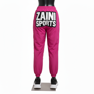 Pantalon coupe-vent pour femme en tissu nylon taffetas, toucher doux, panneaux contrastés roses avec logo en chenille personnalisé, pantalon coupe-vent - Product Image 2