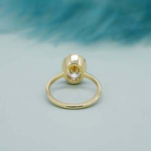 Oval Engagement <b>Ring</b> in Yellow Gold with Bezel Set <b>Diamond</b> Elegant <b>Diamond</b> <b>Rings</b> Collection - Product Image 4