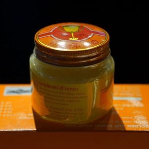 ยาหม่องถ้วยทองขี้ผึ้งสมุนไพรไทยสีเหลือง50ก. ยาหม่องบรรเทาอาการปวดกล้ามเนื้อของแท้สำหรับแก้ปวดข้อ - Product Image 5