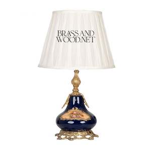 Antique porcelain and brass table <b>lamp</b> with deep blue floral <b>base</b> elegant golden details and fabric shade for timeless luxury - Product Image 1