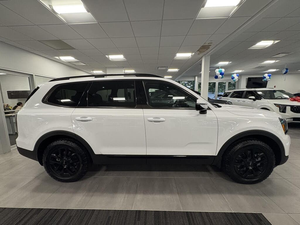 Clean White 2025 K i a Tell uride SX-Prestige X-Pro AWD con asientos de cuero Sistema de navegación Asientos de tercera fila Asientos calefactables - Product Image 6