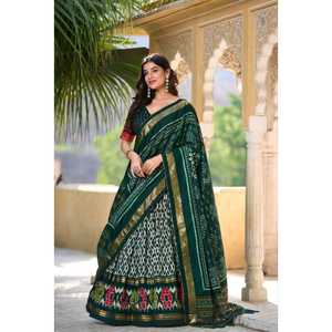 Adorne su estilo moderno con exquisito Lehenga de seda Tussar con fascinantes estampados de Ikkat Patola - Product Image 1