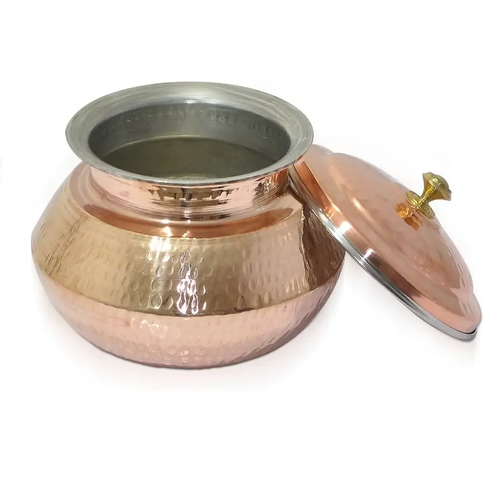 NEW PRODUCT IDEAS HAMMERED COPPER EXTERIOR ATTRACTIVE TO THE EYE & EXCELLENT CONDUCTOR OF HEAT FOR USE ON THE STOVE