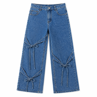 Jean ample taille haute pour femme style Y2K avec détail noué, coupe décontractée, denim délavé clair, écologique et respirant, idéal pour l'été
