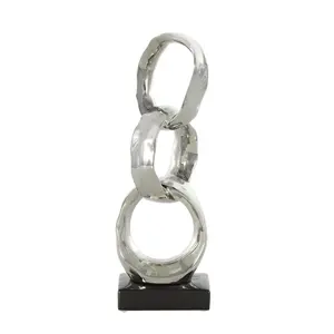Anillos de metal de aluminio La escultura abstracta con base negra es una pieza decorativa probablemente diseñada para la escultura pulida moderna del hogar - Product Image 1