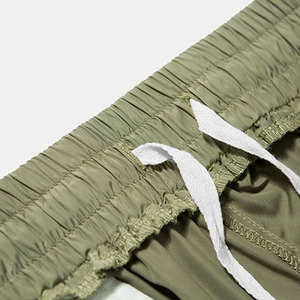 กางเกงไนลอนผู้ชายแห้งเร็ว ออกแบบมาสำหรับกีฬากลางแจ้งและคำสั่งซื้อส่งออกจำนวนมาก ปี 2026 - Product Image 5