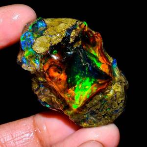 Pierre brute d'opale éthiopienne de feu ultra arc-en-ciel véritable fantastique opale de feu de qualité AA + bijoux de pendentif brut d'opale éthiopienne noire brute - Product Image 1