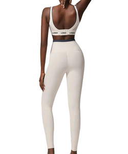 Leggings de cintura alta para mujer, de color sólido, elásticos, sin costuras, estilo deportivo, con logo en la pierna derecha. - Product Image 2