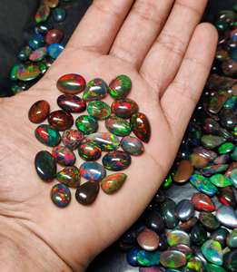 ส่งออกคุณภาพหินโอปอลสีดำเอธิโอเปียอัญมณีโอปอลไฟหลายสีธรรมชาติทรงหลังเบี้ยโอปอลสีดำสำหรับทำเครื่องประดับใช้เป็นจำนวนมาก - Product Image 2