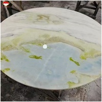 Table à manger élégante en marbre bleu Maldives avec plateau tournant, table basse en marbre bleu lac et comptoir d'îlot design banquette