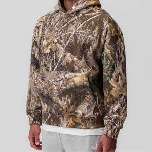 Tech Terry Hoodie - EDGE Camo, diseño unisex con ajuste relajado, estiramiento de cuatro vías y capucha segura con botón a presión - Product Image 1
