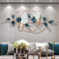 Décoration murale Art Déco sur mesure en laiton moulé, motif grande feuille, fil soudé, cadre thermolaqué, design indien, or et noir, best-seller