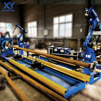 Station de soudage robotisée industrielle Xuanye pour tuyaux, positionneur sur rail au sol de 6 m |   Moteur servo-électrique à 6 axes |   Classement IP67 |   Circulaire