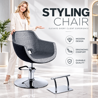 Chaise de coiffure hydraulique grise rembourrée avec repose-pieds et base ronde pour salon de coiffure professionnel