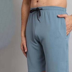 กางเกงว่ายน้ำขาสั้นผู้ชายกางเกงวิ่งจ๊อกกิ้งผ้าโพลีเอสเตอร์เอวยางยืดมีเชือกผูกสีพื้นสำหรับ100% วิ่งและว่ายน้ำ - Product Image 4