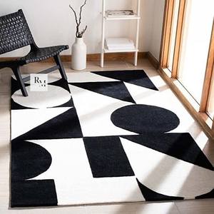 Tapis en laine monochrome abstrait à découpe en boucle avec formes graphiques audacieuses pour les intérieurs contemporains de salons et de chambres - Product Image 1
