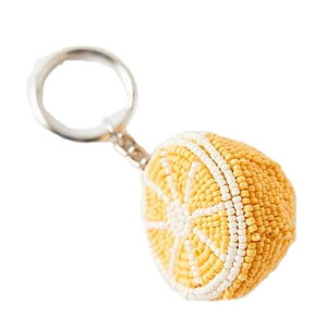 Magnifique porte-clés et accessoires de sac brodés de perles de graines de couleur jaune et blanche à motif citron, en provenance d'Inde - Product Image 1