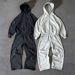 Sweat-shirts d'hiver imprimés avec logo personnalisé pour hommes Ensemble de pantalons de survêtement évasés en coton à capuche et fermeture éclair Vente en gros - Product Image 1