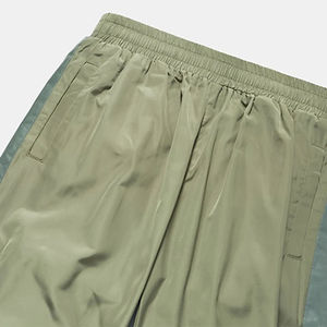 Veste coupe-vent unisexe tendance en nylon, coupe régulière, poches latérales à fermeture éclair, pantalon en nylon ajusté, séchage rapide, bas ample - Product Image 6