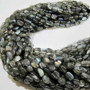 Labradorita natural Oval Plain Smooth 6to10mm Beads Blue Flashy Strands 13 pulgadas de largo - Product Image 1