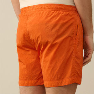Pantalones cortos de playa sólidos de poliéster 100% naranja brillante personalizados, bañadores de verano ligeros de secado rápido para hombre, cintura elástica con cordón - Product Image 6