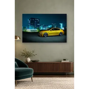 Impression sur toile de la BMW M4 jaune Fida dans les lumières de la ville nocturne - Product Image 1