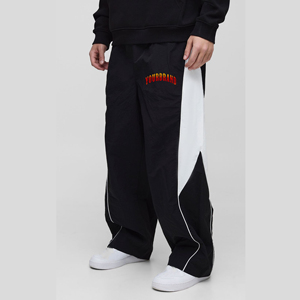 OEM/ODM 100% Nylon al aire libre Ripstop pantalones de hombre lavado a medida tela cortavientos de moda con paneles laterales transpirable hombre pantalón - Product Image 1