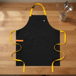 Tablier noir avec bretelles jaunes en toile robuste, réutilisable, style classique, 3 poches, lavable en machine, pour la cuisine et l'usage quotidien - Product Image 1
