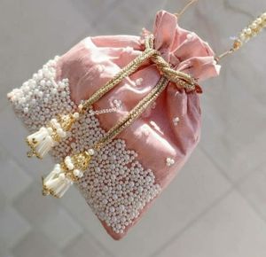 MODERN DESIGN OF POTLI BAG BEAUTIFUL PEARL WORK LATCAN & ZARI EMBROIDERY ON SILK FABRIC FOR PARTY & <b>WEDDING</b> @ 2022 - Product Image 1