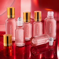 Flacon roll-on en verre rose 30 ml : Flacon roll-on élégant de luxe pour huiles essentielles et parfums, vente en gros sous marque privée