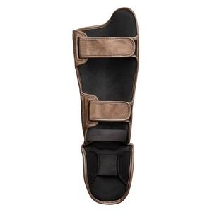 Protections de tibia professionnelles avec rembourrage en mousse haute densité, sangles ajustables à crochets et boucles, et support ergonomique pour les jambes - Product Image 3