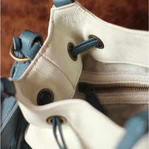 Handmade Two-Tone Leather Bucket <b>Bag</b> Symphony Drawstring Shoulder <b>Bag</b> with Genuine Leather Finish and Multi-Pocket Design - Product Image 4