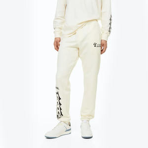 กางเกงวอร์มสำหรับวิ่งจ๊อกกิ้งรุ่นพื้นฐานสีเบจสำหรับผู้ชายมีสไตล์พิมพ์ลายหน้าจอออกแบบได้ตามต้องการและเอวยางยืด - Product Image 2