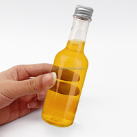 Bouteille de vin ronde vide en plastique Bouteille d'eau de jus de vin en plastique à long cou pour boire avec couvercle en aluminium