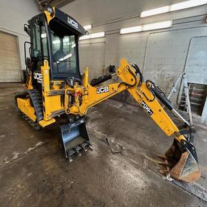 Mini-chargeuse sur chenilles JCB 1CXLT jaune avec godet frontal pour la construction - Product Image 2