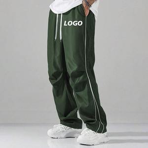 Pantalones de chándal de nailon laterales a rayas fluorescentes holgados rectos para Hombre Ropa de calle con logotipo personalizado con estilo técnico impreso - Product Image 5