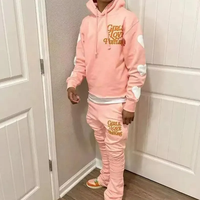 Conjunto de chándal de invierno de moda con estampado serigrafiado, sudadera con capucha corta de dobladillo sin rematar y pantalones de chándal de forro polar acampanados apilados para hombre y maternidad