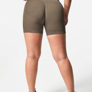 Venta al por mayor de pantalones cortos de motorista sin costuras de color sólido para correr las mujeres de yoga pantalones cortos de gimnasio de control de barriga mujeres pantalones cortos de yoga amarillo - Product Image 5