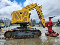 Tracteur forestier sur chenilles CATERPILLAR XT430-5 d'occasion de qualité avec pelle rétrocaveuse et chargeur frontal