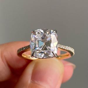 Anillo de moissanita con cojín de estilo vintage, solitario de 8x9mm con juego de Halo invisible en la banda de la catedral con tres cuartas eternidades - Product Image 1