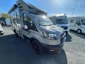 Autocaravana Ford Transit Gris, Vehículo Convertible para Pasajeros y Carga, Ideal para Viajes y Campamentos - Product Image 1