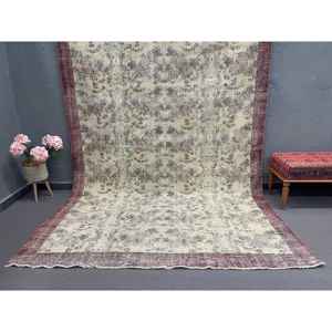 Alfombra Turca de 7x10 pies, Alfombra Vintage de Lana con Borde Marrón - Product Image 1