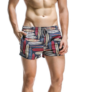 กางเกงว่ายน้ำเล่นยิมทรงหลวมสีพื้นกางเกงขาสั้นสำหรับผู้ชายพิมพ์ลายดอกไม้แห้งเร็วระบายอากาศได้ดี - Product Image 1