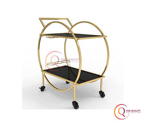 Encanto contemporáneo El carrito de barra circular dorado con elegantes estantes de vidrio negro y ruedas de diseño funcional se ve elegante. - Product Image 5