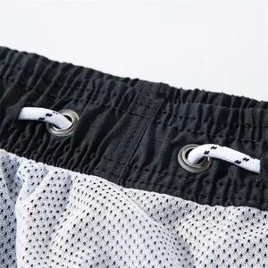 Short de sport décontracté pour hommes, ample et respirant, vente en gros, extensible sur les quatre côtés, pantalon de surf de plage à séchage rapide, motif solide de poches moyennes - Product Image 2