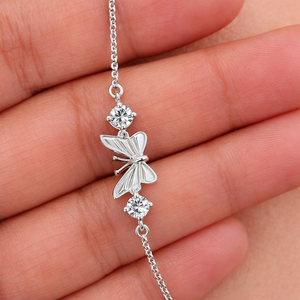 Pulsera Clásica de Plata de Ley con Baño de Rodio y Mariposa con Circonitas de Rhaya Jewels para Fiestas de Boda Infantiles y Regalos - Product Image 1